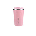 Coffeeworkz Insulated Tumbler on wooden table with coffee beans and accessories – perfect for on-the-go coffee lovers​
