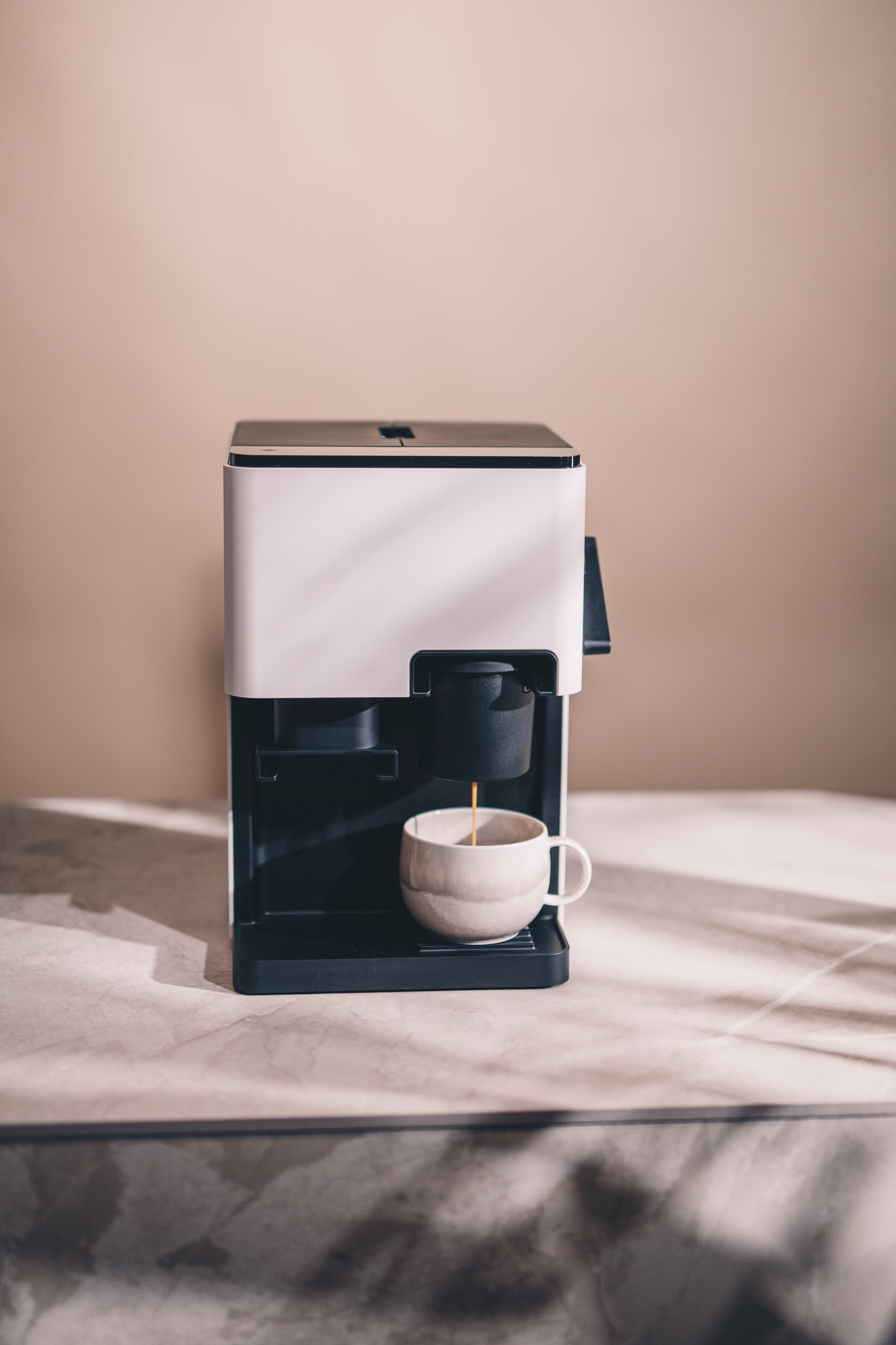 Front view of Nivona CUBE 4102 showcasing intuitive touch controls and minimalist design